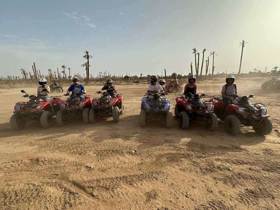 Marrakech: Desert and Palm Grove Sunset Quad Tour with Tea - Tea, bread, honey, and a pause with local hosts