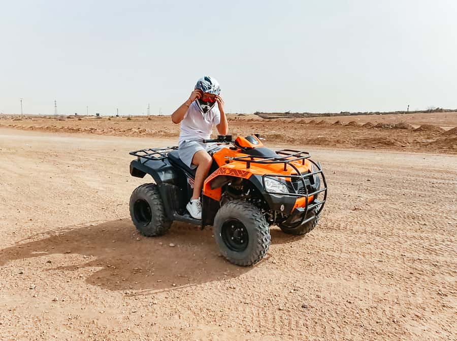 Marrakech: Quad Bike Tour to Palm Oasis and Jbilat Desert - Palm trees, phones, and memorable photos