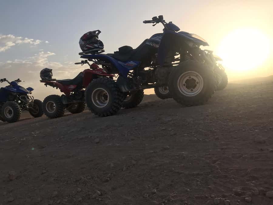 Marrakesh: Agafay Desert Quad & Camel Tour with Dinner - Sunset over the rocky desert