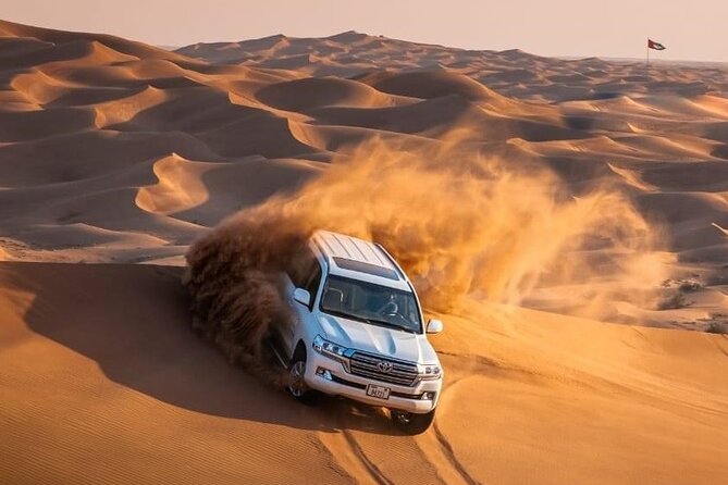 Morning Red Dunes Desert by Quad Bike, Dune Bashing, Camel Ride & Sandboarding - Sandboarding Down the High Dunes