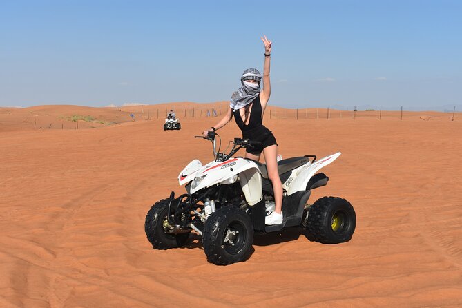 Sunset Desert Safari Quad bike Camel ride Sand Board & BBQ Dinner - Dune bashing and the sunset photo stop